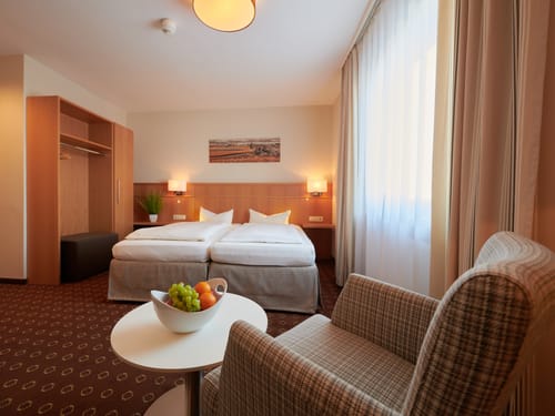 Großes Doppelzimmer mit einer gemütlichen Sitzecke